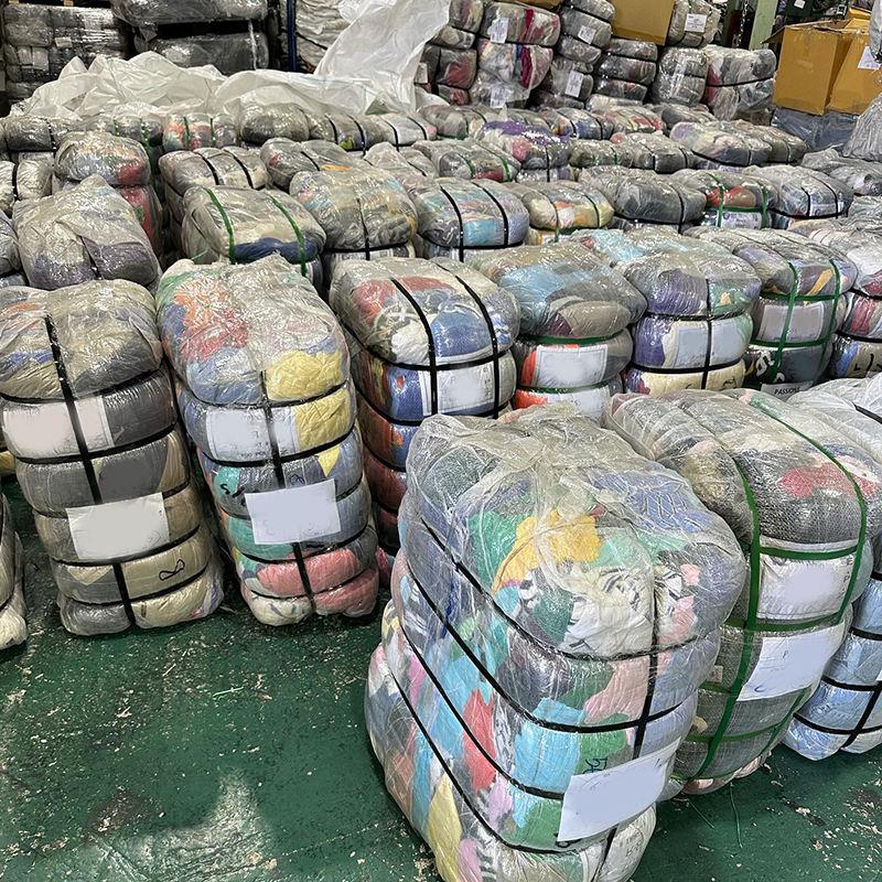 Compressed 45kg mixed clothing bales strapped and labelled ready for wholesale ukay ukay buyers