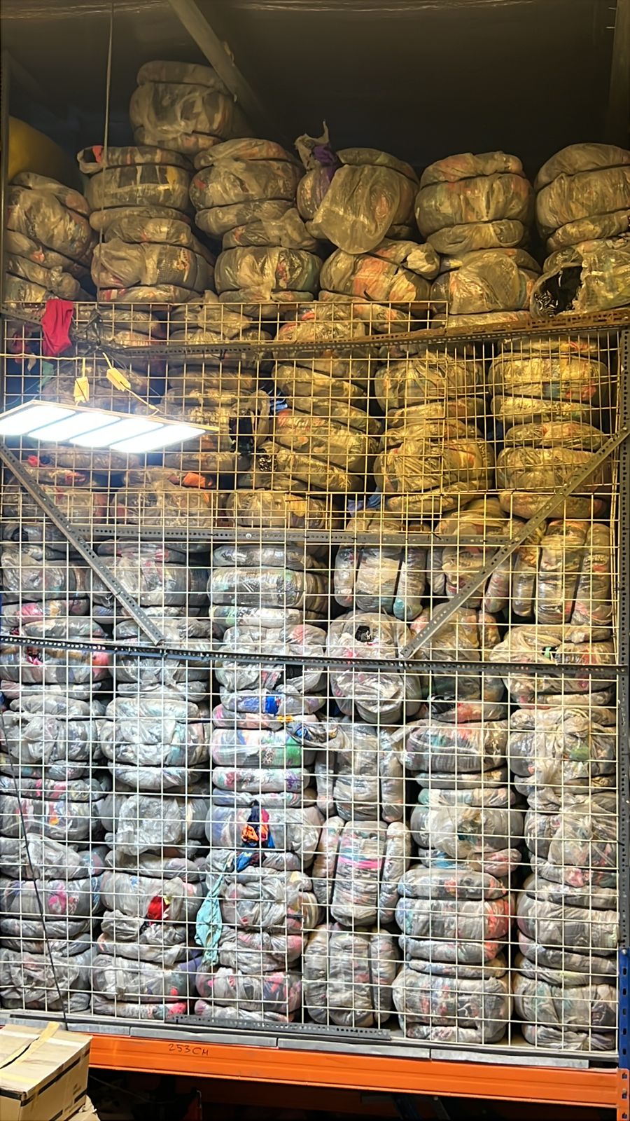 Caged pallet storage of premium wholesale Ukay Ukay clothing bales ready for UAE and export dispatch